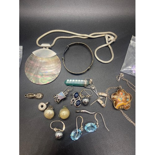 75 - Selection of silver jewellery to include earrings, pendants, necklaces and baby bangle.