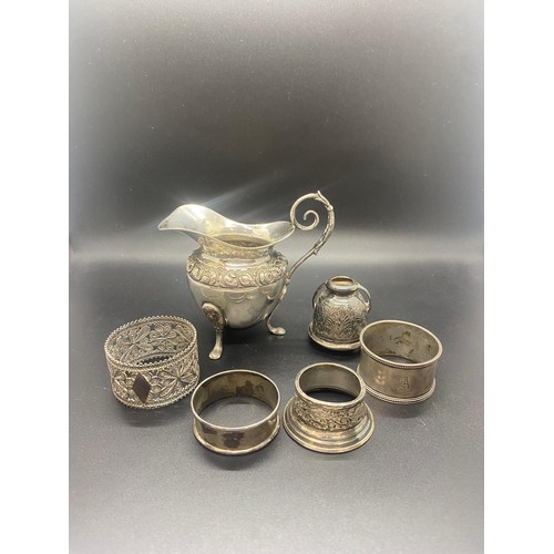 78 - Collection of antique silver items to include 3 legged milk jug and napkin rings etc. 209g