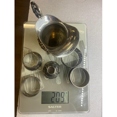 78 - Collection of antique silver items to include 3 legged milk jug and napkin rings etc. 209g