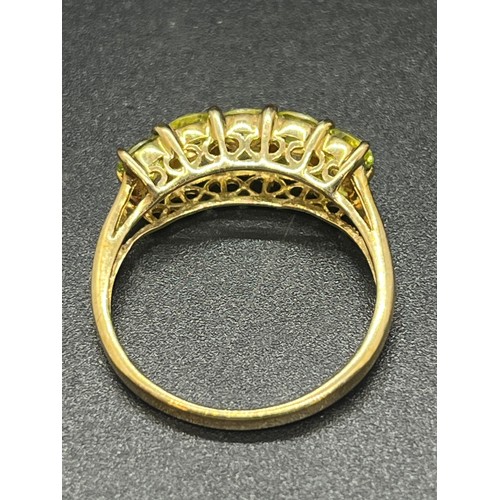 133 - 9ct gold, diamond & emerald ladies ring