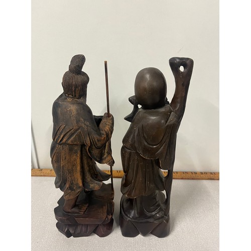 123 - 2 oriental wooden carved immortal figures. Tallest 12