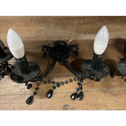 441 - 3 black glass chandeliers along with 8 wall sconces with shades