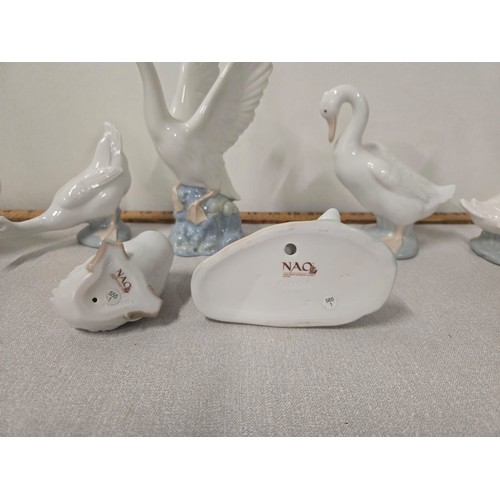 61 - 7 Nao geese figurines.