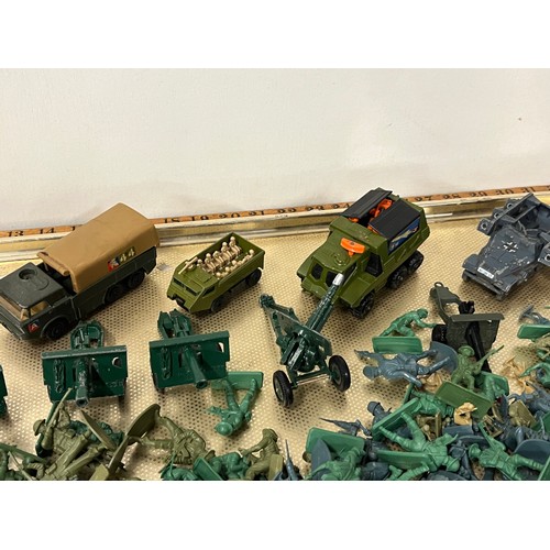 151 - Large tray of soldiers along with diecast military vehicles to include Corgi and Matchbox.