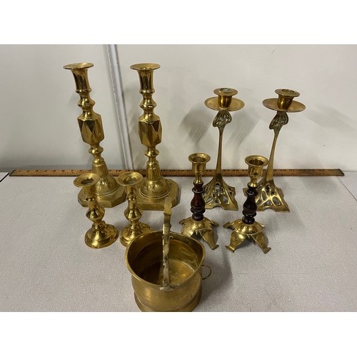 56 - Selection of brass candlesticks to include Art Nouveau.