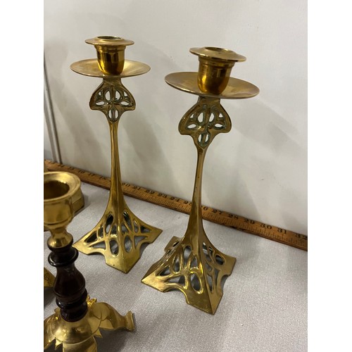 56 - Selection of brass candlesticks to include Art Nouveau.