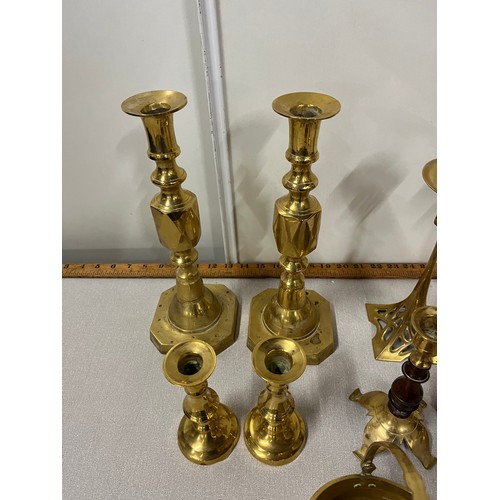 56 - Selection of brass candlesticks to include Art Nouveau.