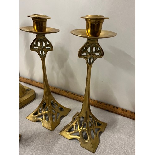 56 - Selection of brass candlesticks to include Art Nouveau.