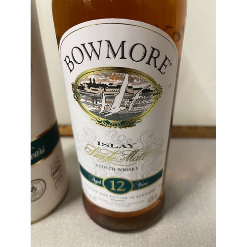 84 - Bowmore 12 Year Old Single Malt Scotch Whisky, 70cl, 40% with presentation tin. An old discontinued ... 