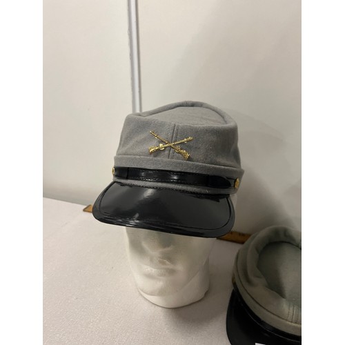 71 - A collection of four navy & police vintage hats