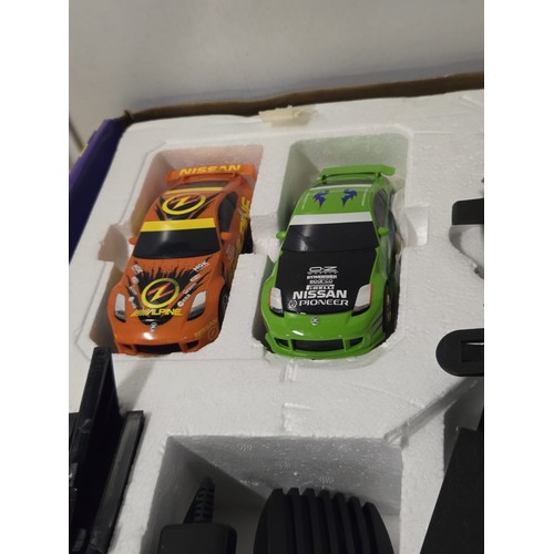 142 - Scalextric sport powerslide drift Nissan 350z cars.