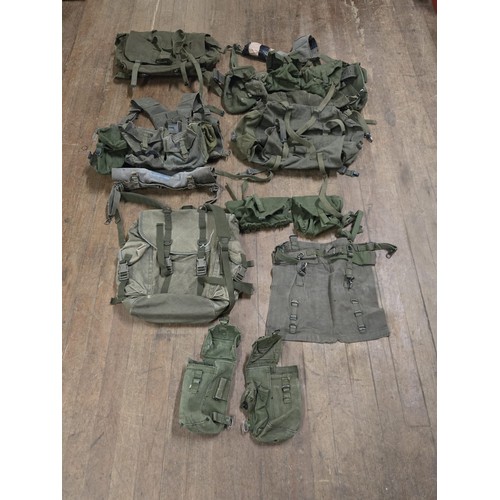 498 - Selection of military ware to include webbing, bags & joint services dressing first aid pack etc.