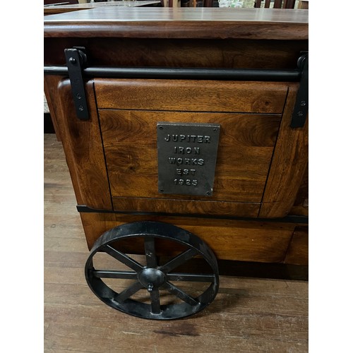 28 - Heavy Solid mango wood Jupiter iron work est 1925 wine cart, with sliding barn style door, one openi... 