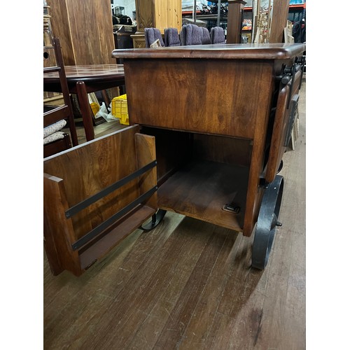 28 - Heavy Solid mango wood Jupiter iron work est 1925 wine cart, with sliding barn style door, one openi... 