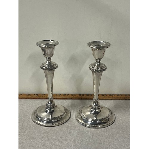 13 - Pair of silver hallmarked weighted candlesticks 9