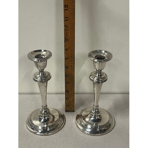 13 - Pair of silver hallmarked weighted candlesticks 9