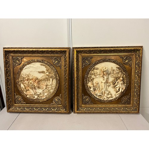 81 - Pair of large gilt framed resin plaques classic scenes in the style of Enrico Braga. 23.5