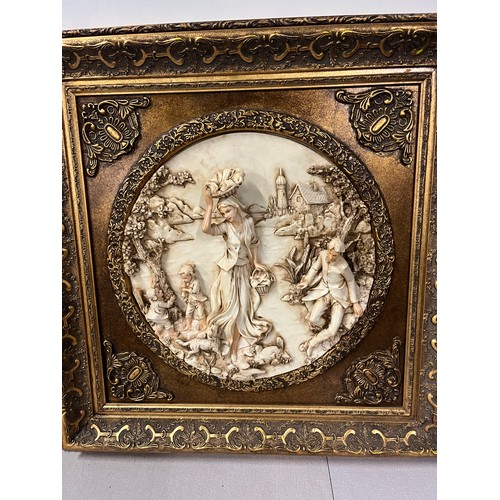 81 - Pair of large gilt framed resin plaques classic scenes in the style of Enrico Braga. 23.5