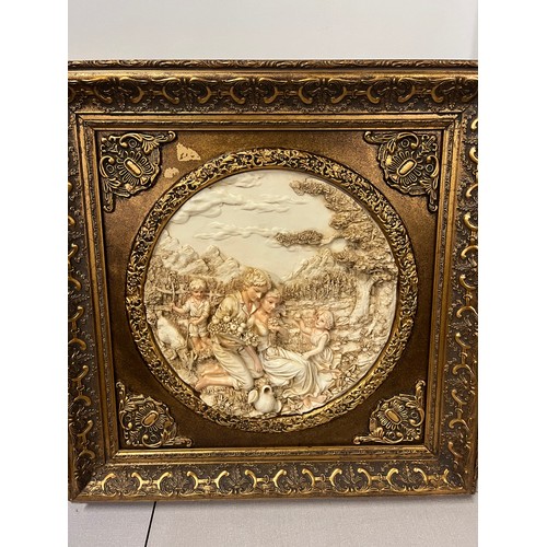 81 - Pair of large gilt framed resin plaques classic scenes in the style of Enrico Braga. 23.5