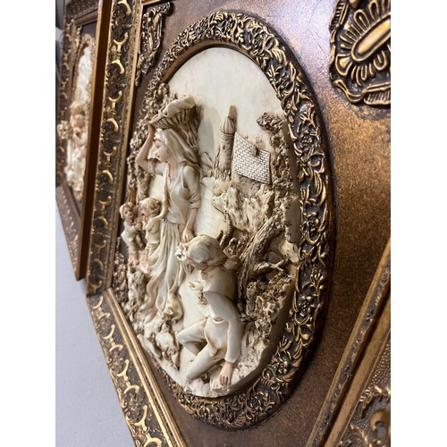 81 - Pair of large gilt framed resin plaques classic scenes in the style of Enrico Braga. 23.5