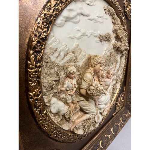 81 - Pair of large gilt framed resin plaques classic scenes in the style of Enrico Braga. 23.5