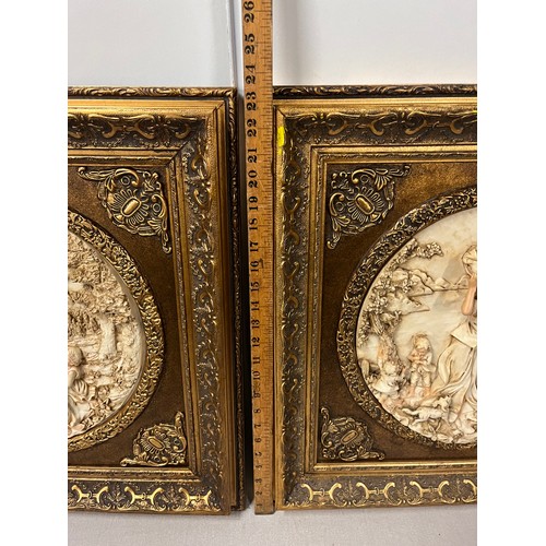 81 - Pair of large gilt framed resin plaques classic scenes in the style of Enrico Braga. 23.5