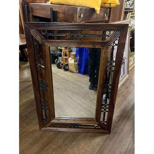 Heavy wood & wrought iron framed mirror.