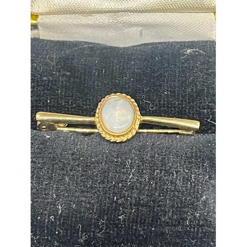 63 - 2 9ct gold pins along with 9ct & opal brooch