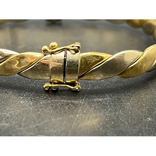 86 - 9ct 2 tone gold bangle 10.7 grams