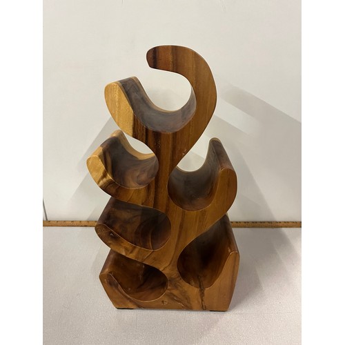 77 - Solid wood leaf shape wine rack, holds 6 bottles. 20