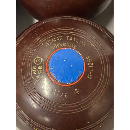 338 - 2 sets of lawn bowls and leather carry cased - Thomas Taylor and Henselite.