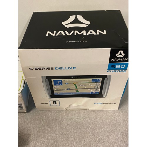 424 - 4 Satnavs to include boxed TomTom go 50, Boxed Nav man s series deluxe & 2 others.