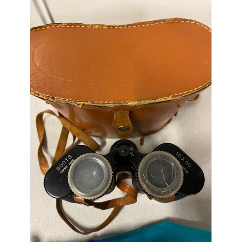 431 - Boots empire binoculars with leather case along with umbrella shooting stick.