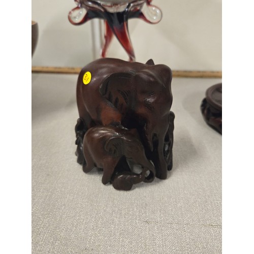 458 - Carved wooden Zebra bowl along with Elephant carvings & art glass dish.