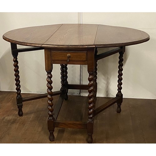 83 - Antique oak barley twist gateleg drop leaf table with 2 drawers.