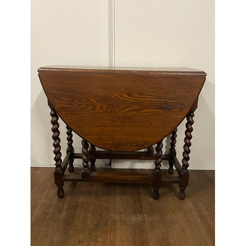 83 - Antique oak barley twist gateleg drop leaf table with 2 drawers.