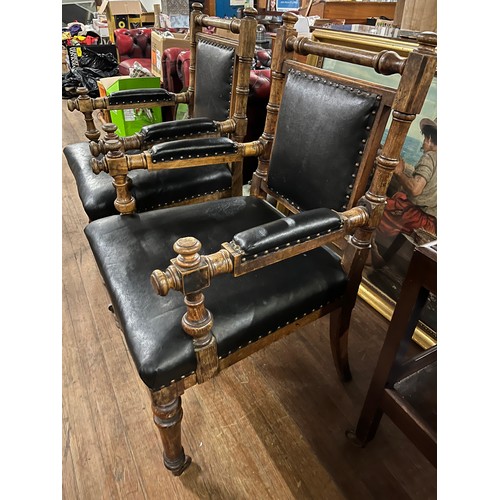 130 - A pair of Victorian oak library chairs