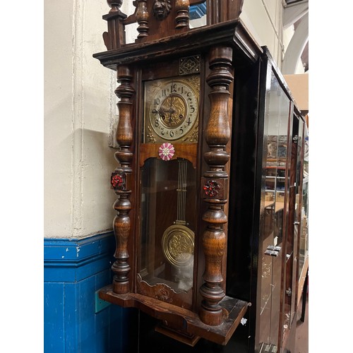 200 - Highly carved antique wall clock possibly? German with key & pendulum (46