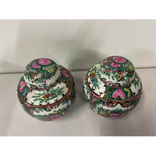 345 - Pair of Rose Medallion handpainted porcelain ginger jars with lids, stamped to the base, decorated i... 