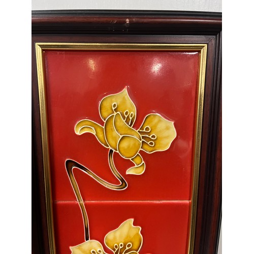 449 - Pair of framed Victorian fireside tiles depicting yellow flower against red background. 33