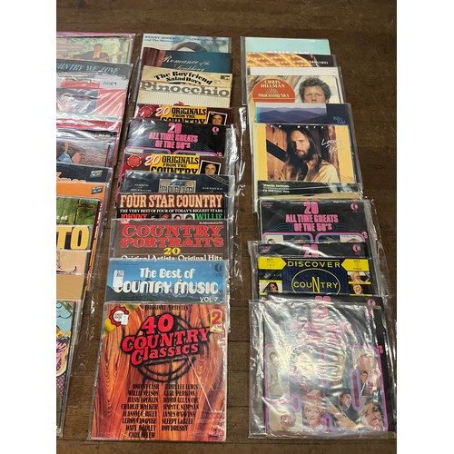 201 - Selection of vinyl record albums to include John Wayne & the cowboys, Burrito Brothers & Wanda Jacks... 