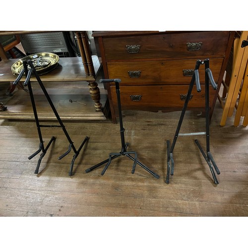 381 - 3 metal folding guitar stands.