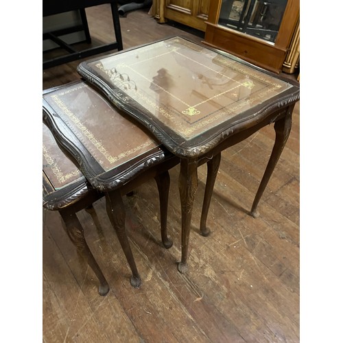 410 - nest of mahogany leather top tables