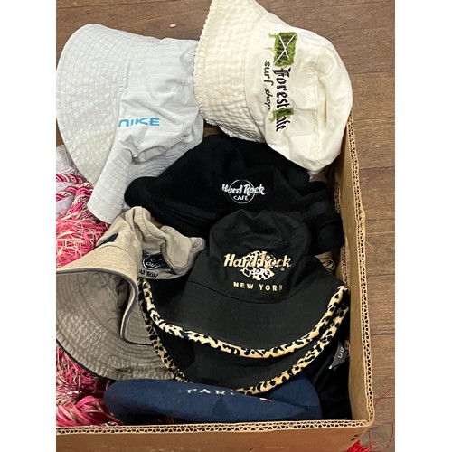 426 - Box of vintage linen, vintage Hard Rock Cafe hats along with curtain tie backs with glass detail.