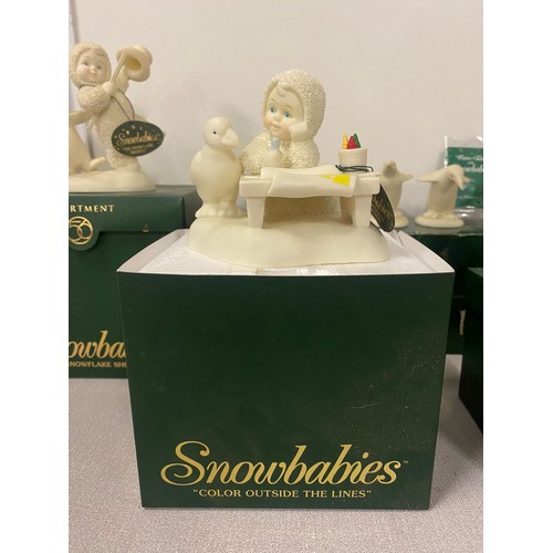 124 - 4 Boxed Snowbabies to include 'parade of penguins' & 'Snowflake shuffle' etc.