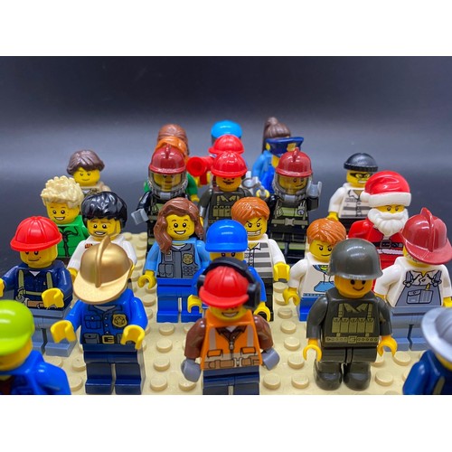 23 - 25 Lego figures to include Santa, fireman, police, miner etc.