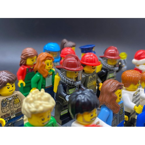 23 - 25 Lego figures to include Santa, fireman, police, miner etc.