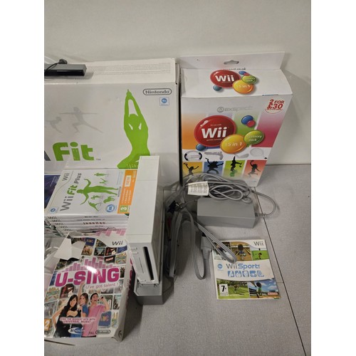 390 - Wii bundle to include Console, Wii fit, Metallica guitar hero, controllers & games etc.