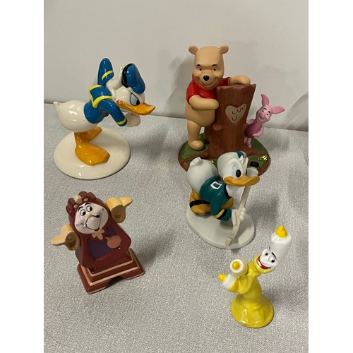 173 - Collection of Disney figures to include Cogsworth, Stitch &  Royal Doulton Donald Duck,