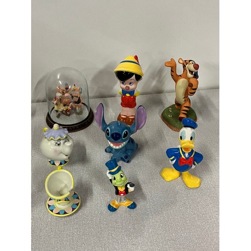 173 - Collection of Disney figures to include Cogsworth, Stitch &  Royal Doulton Donald Duck,